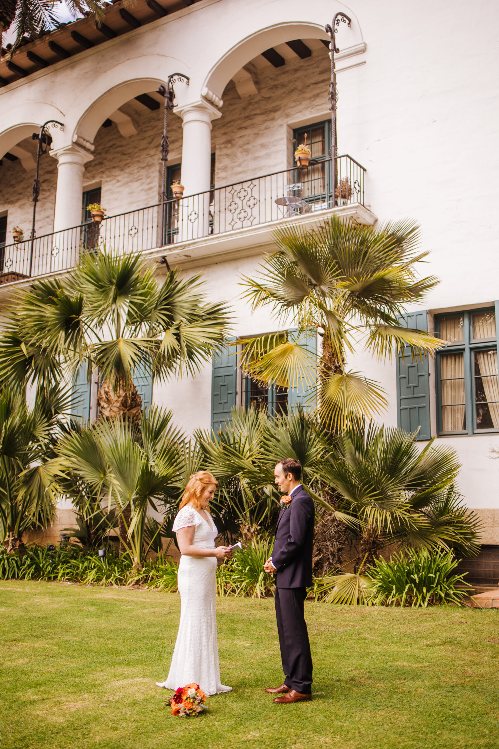 wedding couple exchange private vows on lawn at SB Courthouse