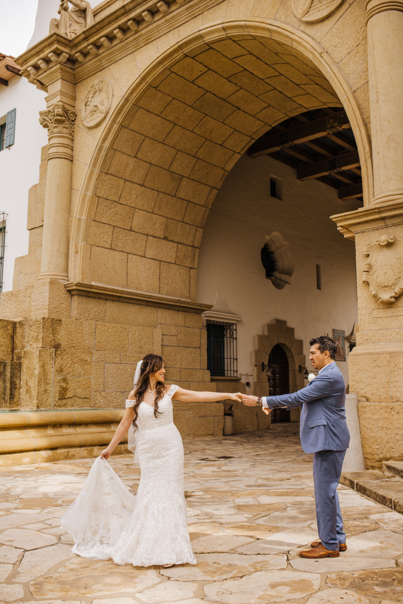 wedding couple dancing together at SB Courthouse