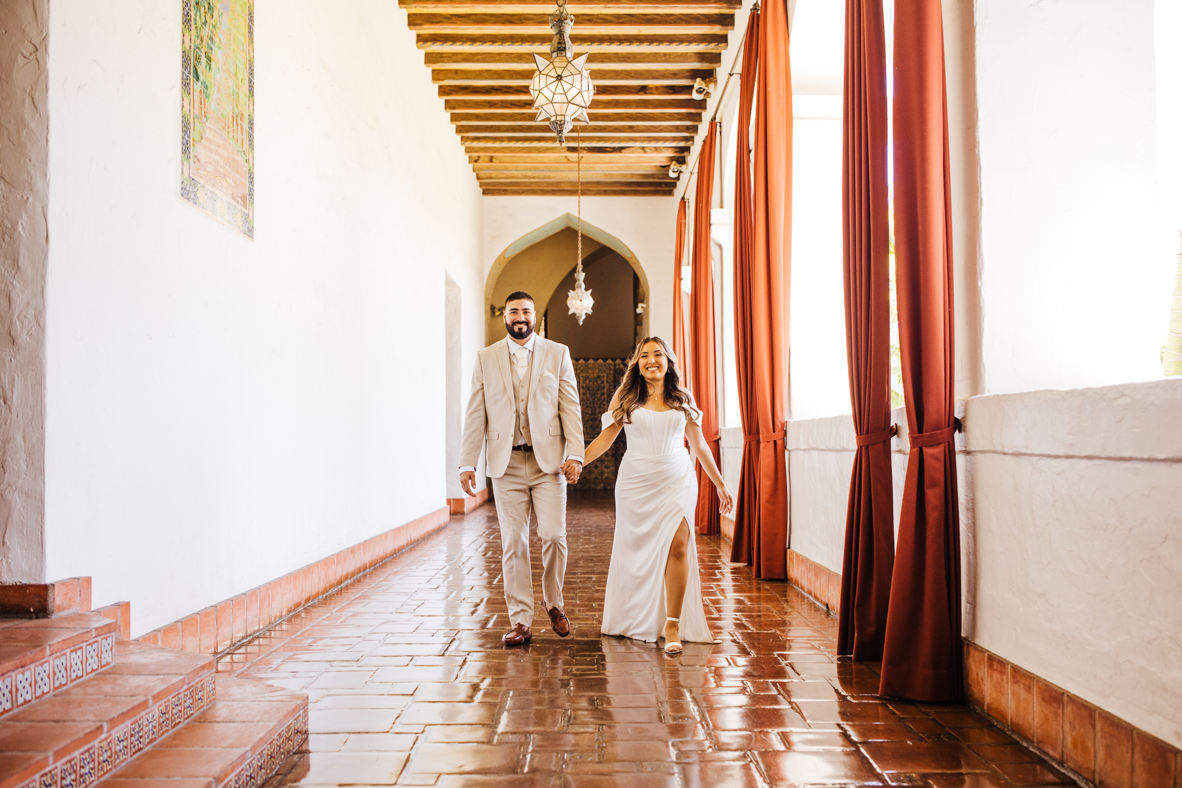 wedding couple walk down the hallway at SB Courthouse