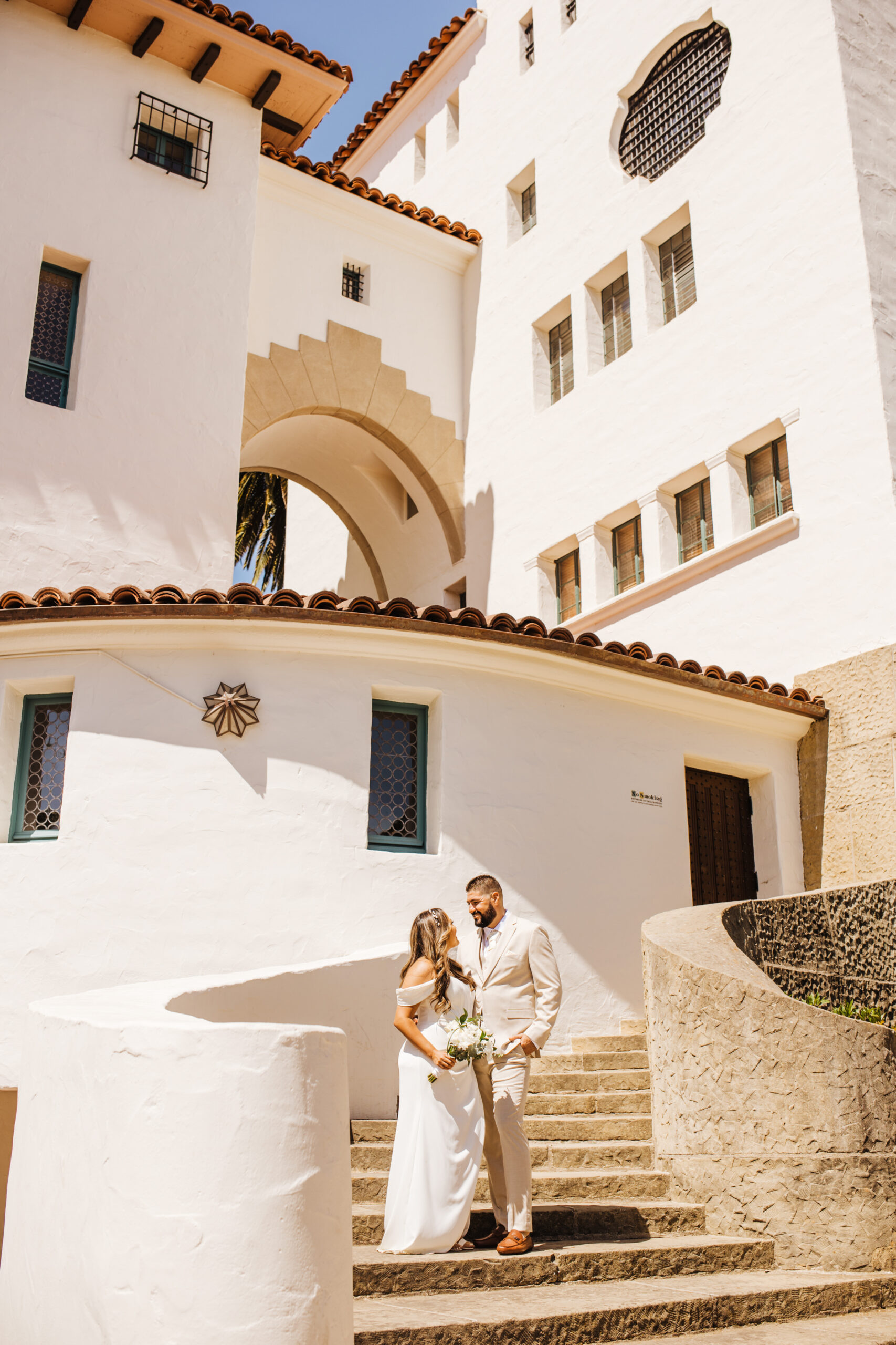 bride and groom on SB Courthouse stairs