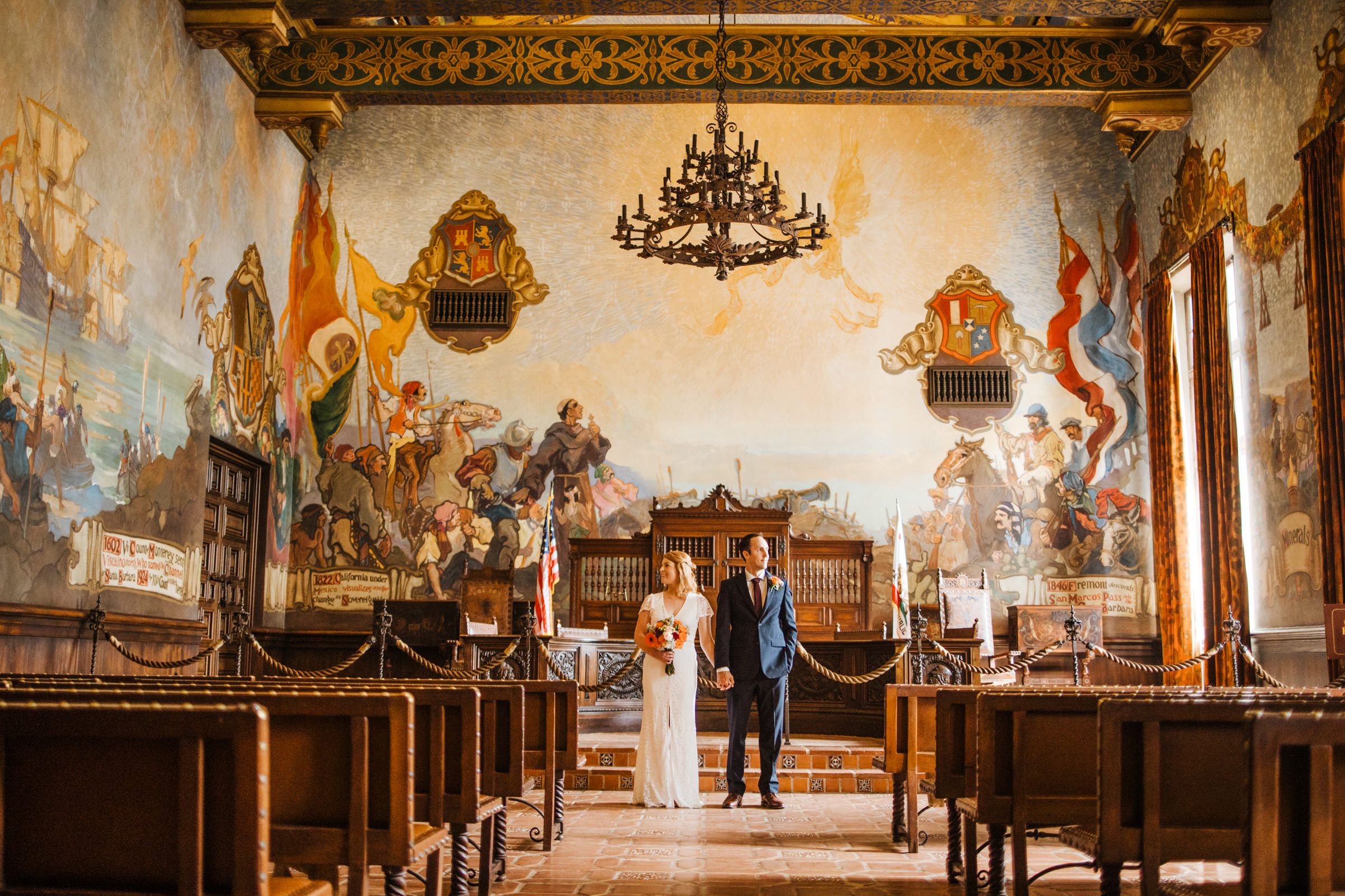 bride and groom in Mural Room at Santa Barbara Courthouse