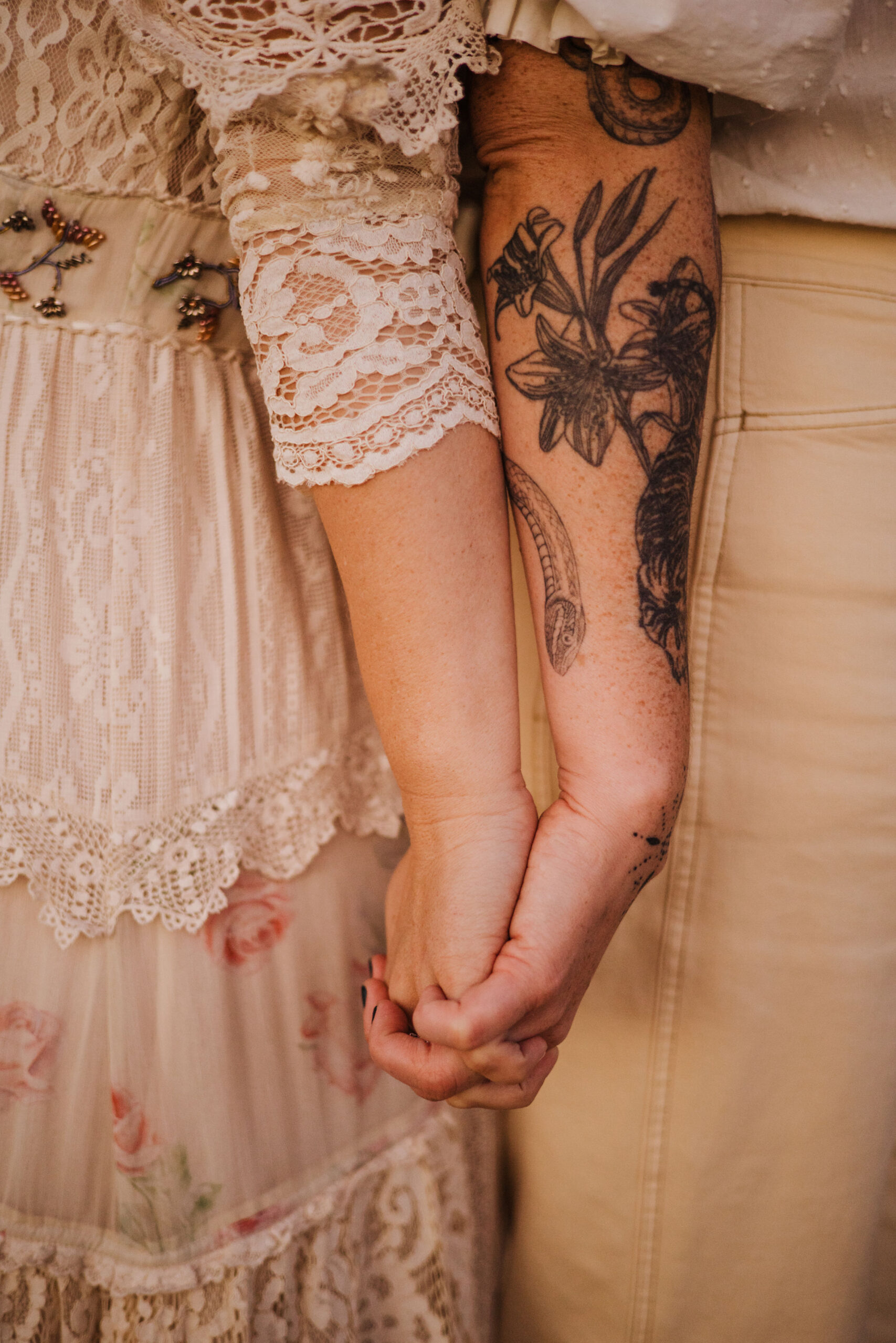 Holding hands tattoos