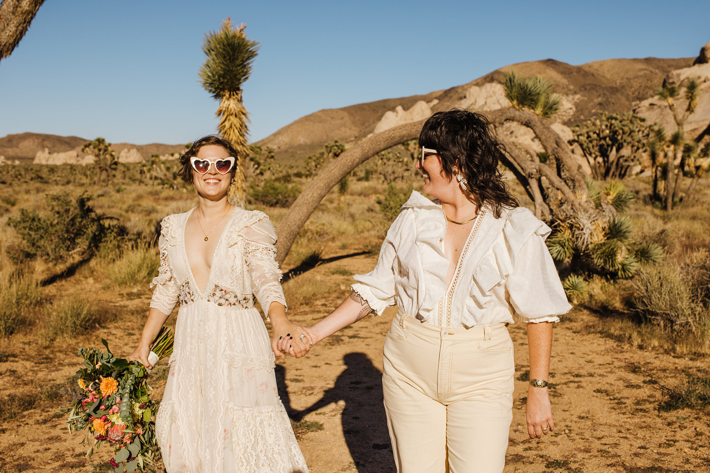 Joshua Tree wedding with two brides in sunglasses