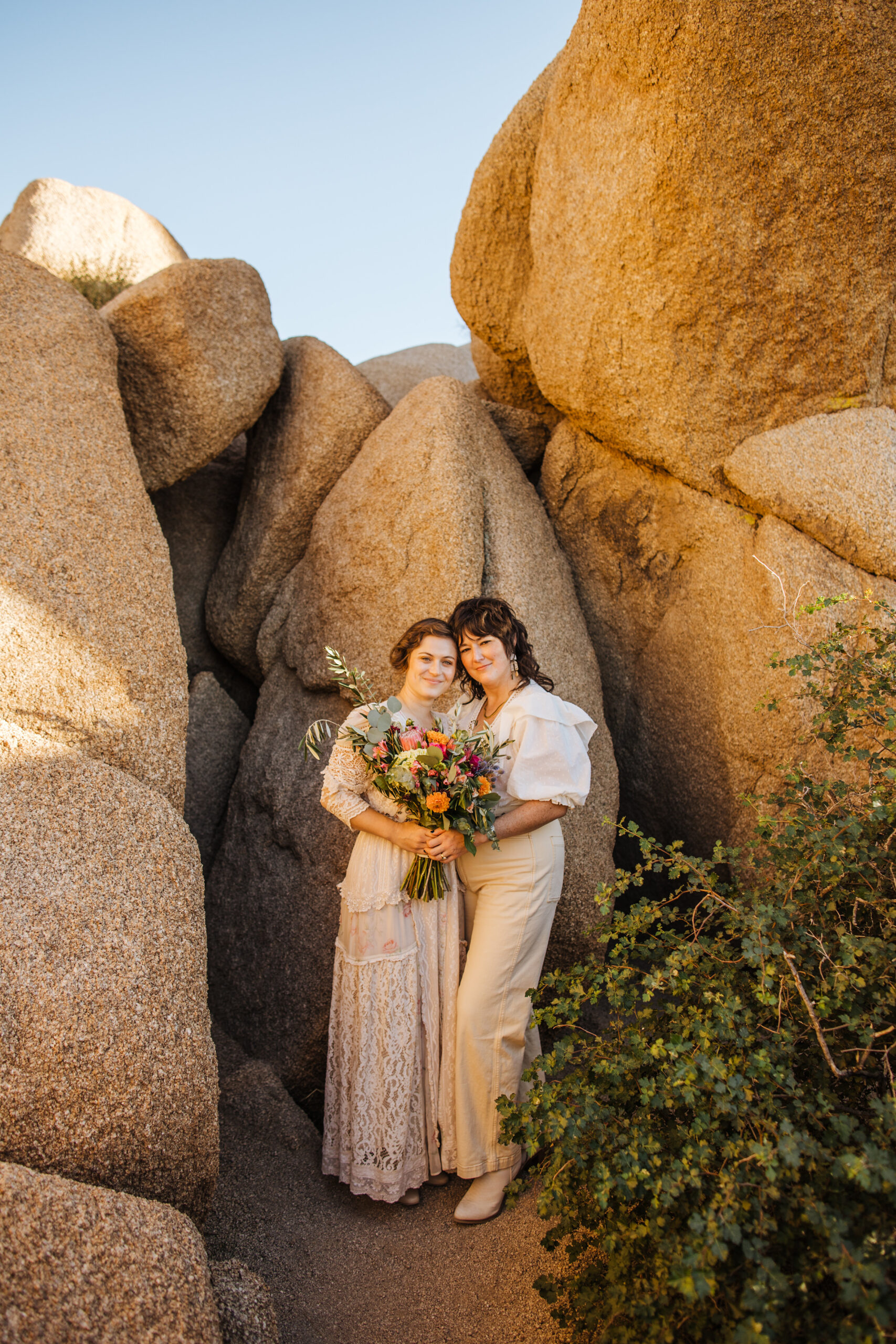 Joshua Tree wedding two brides with boulders