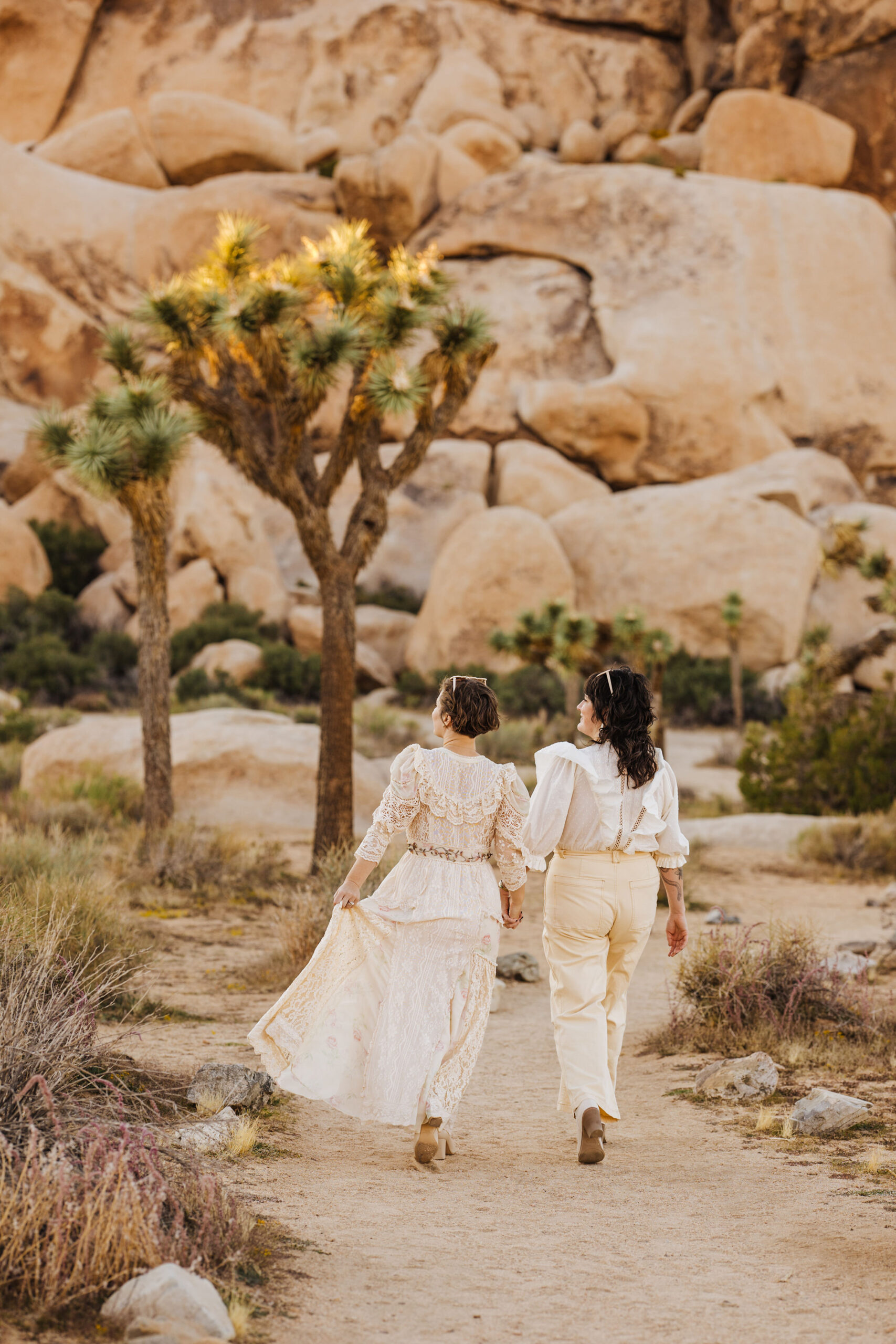 Brides walking in Joshua Tree during elopement