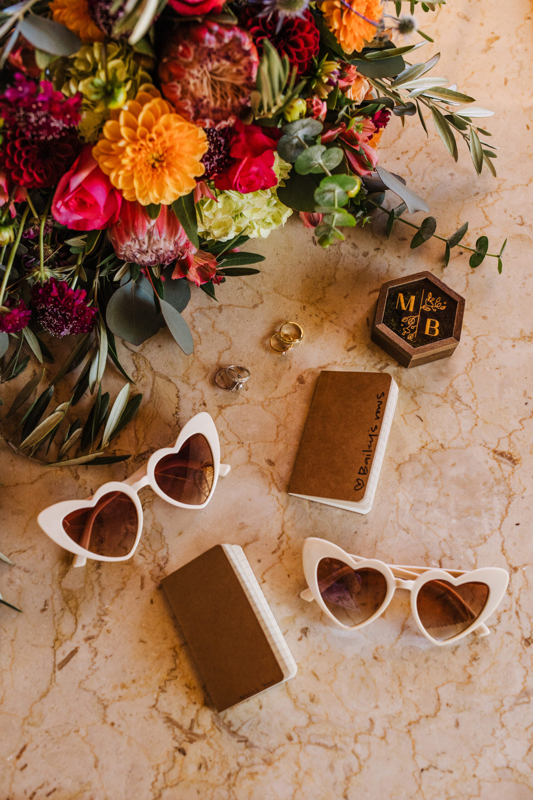 Joshua Tree elopement details with sunglasses and vow books