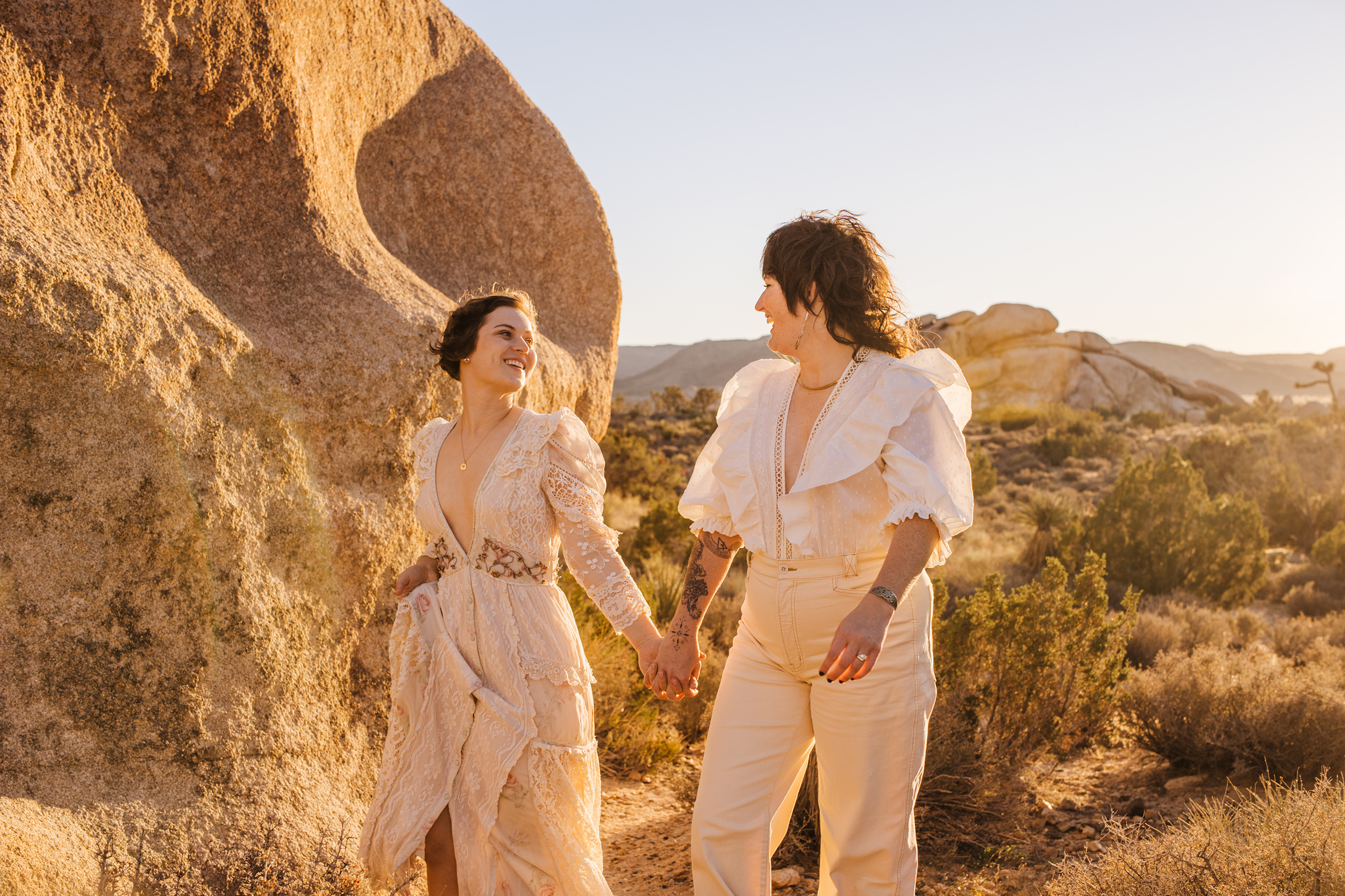 Two brides in Joshua Tree National Park during golden hour